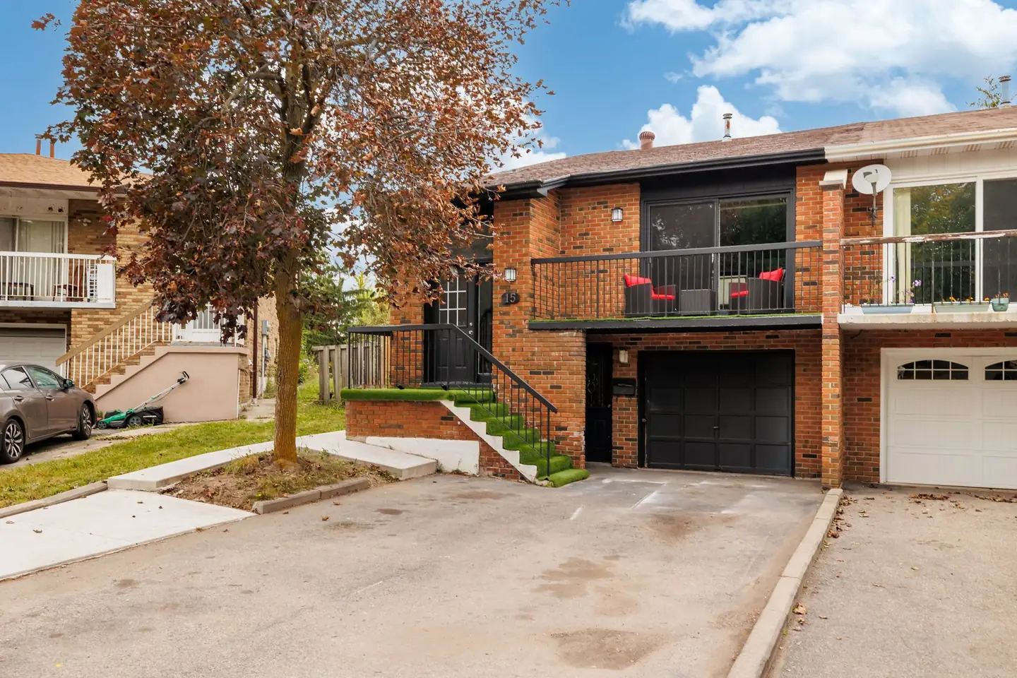 15 Lady Stewart Blvd, Brampton — brick front exterior with front balcony, driveway and built-in garage